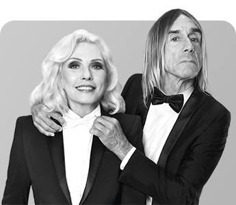 Debbie Harry and Iggy Pop posing in formal dress for Paco Rabanne Black XS